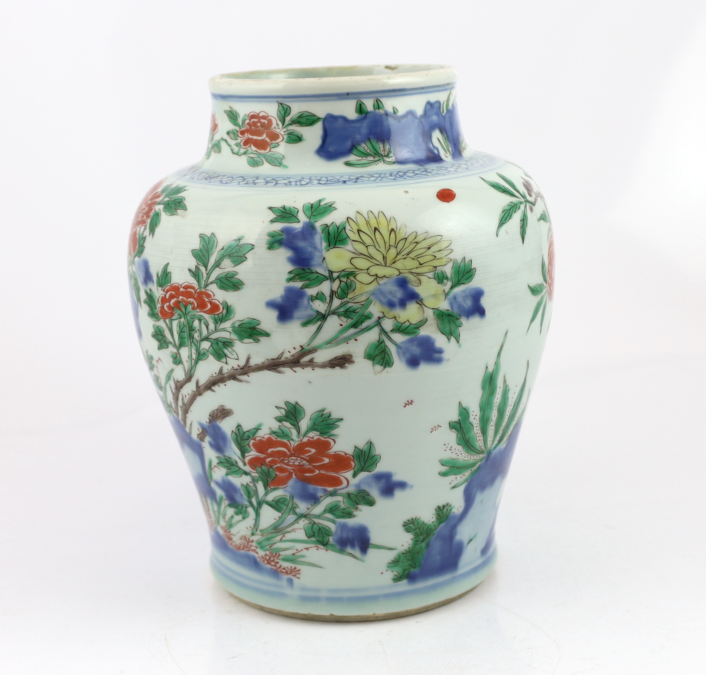 A Chinese wucai ‘rocks and blossom’ vase, Transitional, Shunzhi period, cracked and restoration to neck